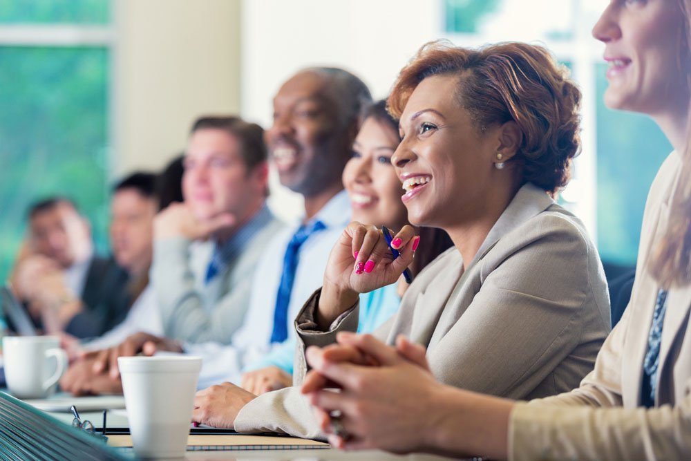 Colleagues in a large meeting