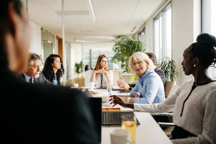 Management personnel in a meeting