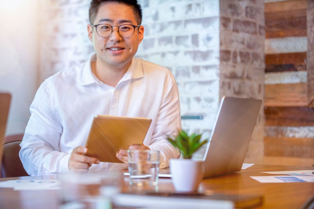 Man using a tablet in a home office